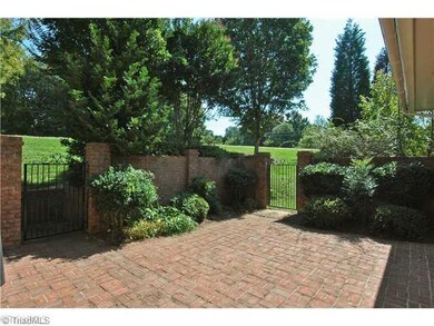 Other. Charming use of brick and wrought iron, the courtyard affords both privacy & distant green views; beautiful mature landscaping is easily maintained with the sprinkler system and the HOA s care in mowing; handy built-in gas grill