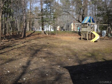 Spacious back yard/ Playset conveys as is.