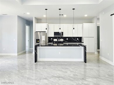 Kitchen with appliances with stainless steel finis