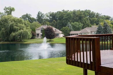 Located against a pond with trees in backdrop