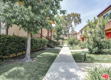 Sidewalk leading to unit