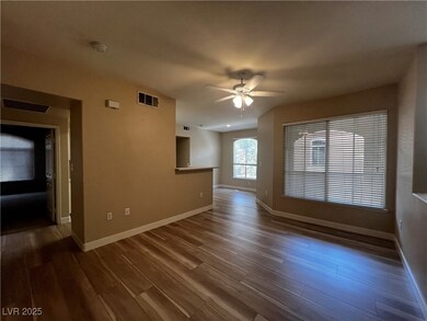 Unfurnished living room with ceiling fan and wood