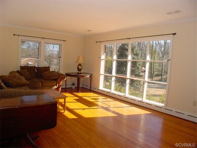 Sunny living room with oak floor