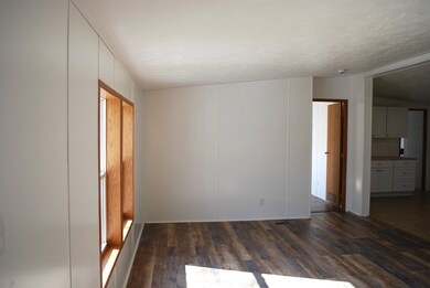 LIVING ROOM FROM THE FRONT ENTRANCE