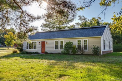 Single story home featuring a front lawn