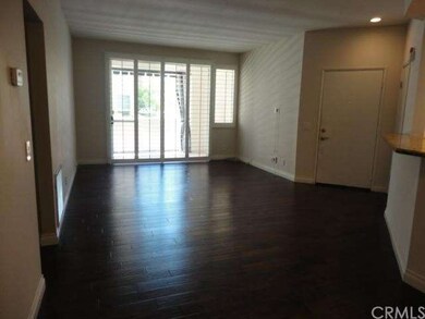 Dark Hardwood Floors and Classic Plantation Shutte