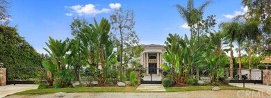 Beautifully treelined entrance with two remote gat