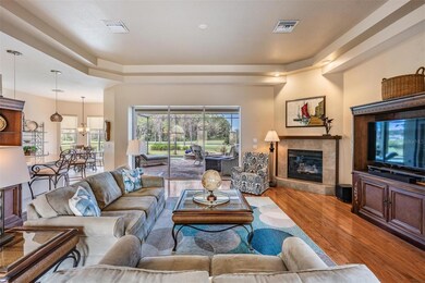 Corner fireplace with a raised hearth, adds comfort on cooler evenings, and the triple slider provides a great view