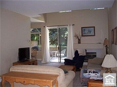 Big great room with fireplace. Sliding door to rea