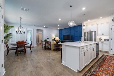 Dining and living rooms, kitchen