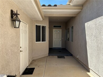 Entrance to property featuring stucco siding