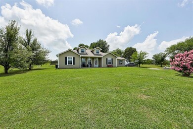 View of front of property featuring a front yard