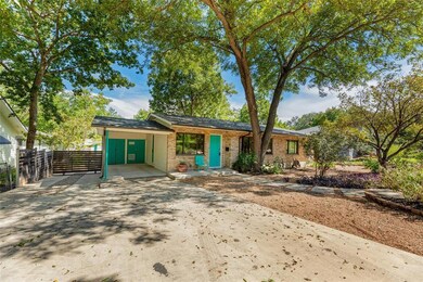 View of front of house featuring concrete drivewa