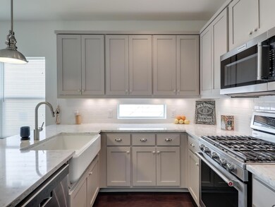 Kitchen featuring appliances with stainless steel