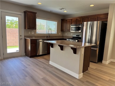 Kitchen with appliances with stainless steel finis