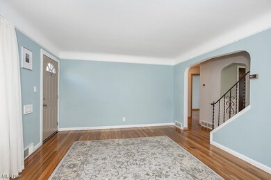 Foyer entrance with dark hardwood / wood-style flooring