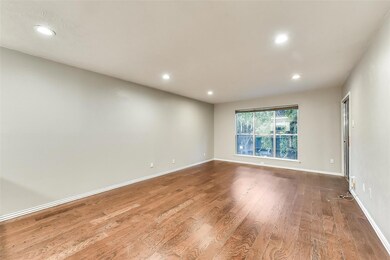 Unfurnished room with hardwood / wood-style floors