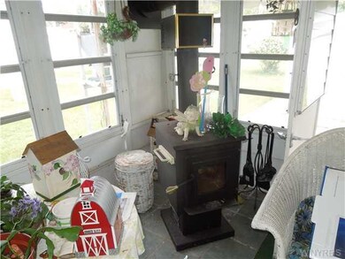 Other. Wood burning stove in enclosed sitting area