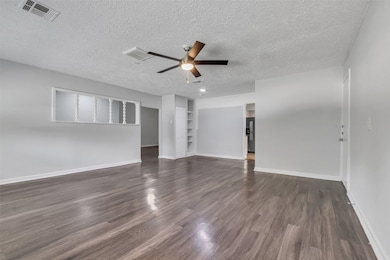 This second living room faces the front yard and o