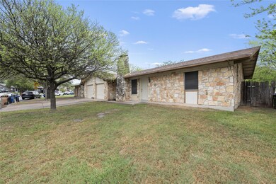 View of front of property featuring driveway, a f