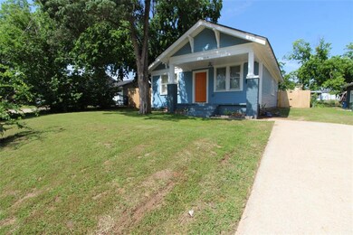View of front of property with a front yard and a 