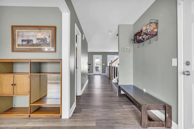 Hall with hardwood / wood-style flooring