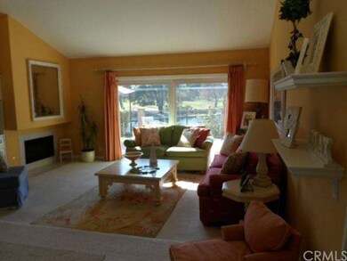 Living room with fireplace, media center and large