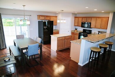 Great kitchen with upgraded lights and breakfast bar.
