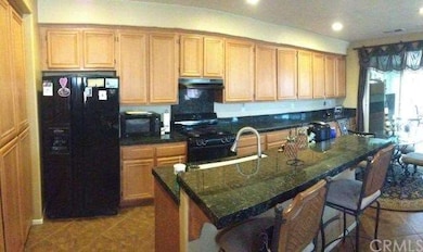 kitchen with granite and tile floor