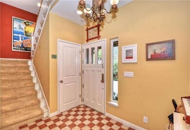 Custom paint and lighting compliment this entryway