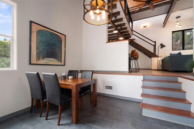 Dining space with stairway, baseboards, visible v