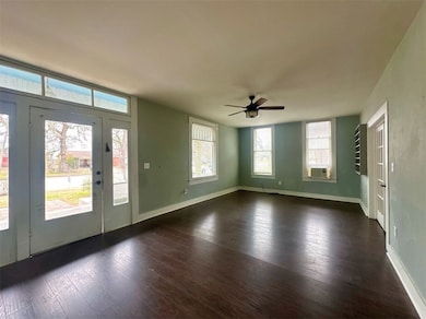 Entrance foyer with dark hardwood / wood-style flo
