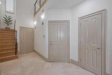 Foyer/entrance.  Check out elevator shaft (back do