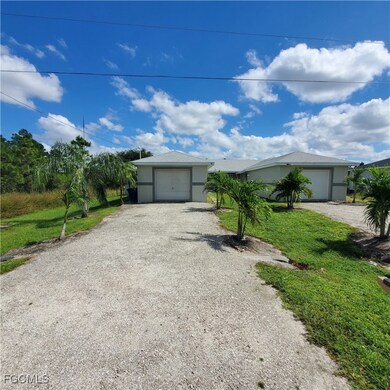 Single story home with gravel driveway and a front lawn
