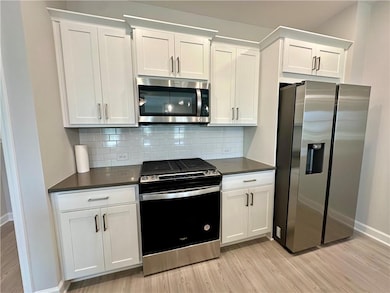 Kitchen with appliances with stainless steel finis