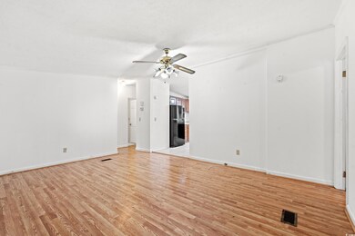 Unfurnished living room with light wood-type floor