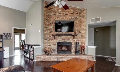 Gorgeous bamboo wood floors and brick fireplace in