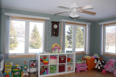 The sunny playroom opens off the living room.  Put