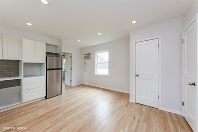 Hardwood floors. New windows and freshly painted.