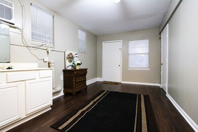 Living area with vanity, fresh paint. and new floo