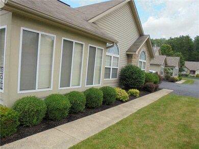 Side view with elegant landscaping.