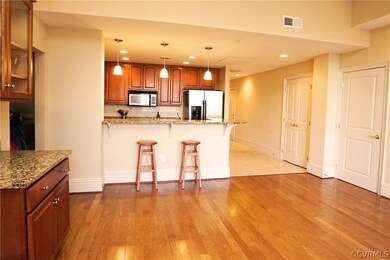 Bookcases in living area with cupboards and glass