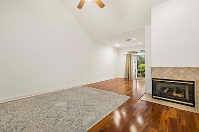 Unfurnished living room with wood finished floors