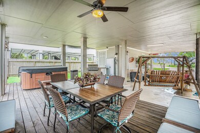 This expansive covered patio, professionally desig