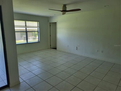 Living room with master bedroom entry in the cente