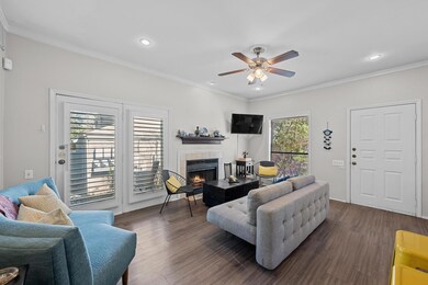 Living area featuring a tiled fireplace, ornament