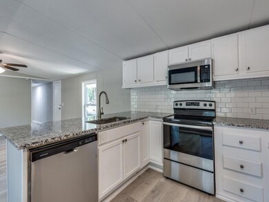 Kitchen featuring appliances with stainless steel 
