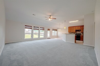 Large windows offer a view of the backyard.