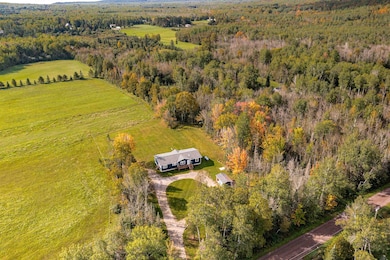 Situated in with wooded features & partially open field.