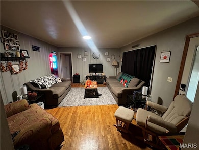 Living area featuring wood finished floors